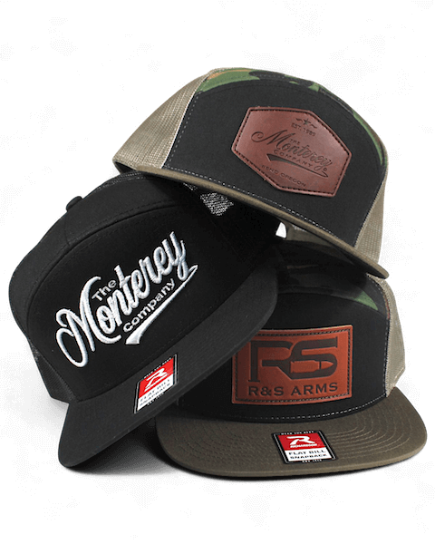 three custom hats stacked on top of eachother