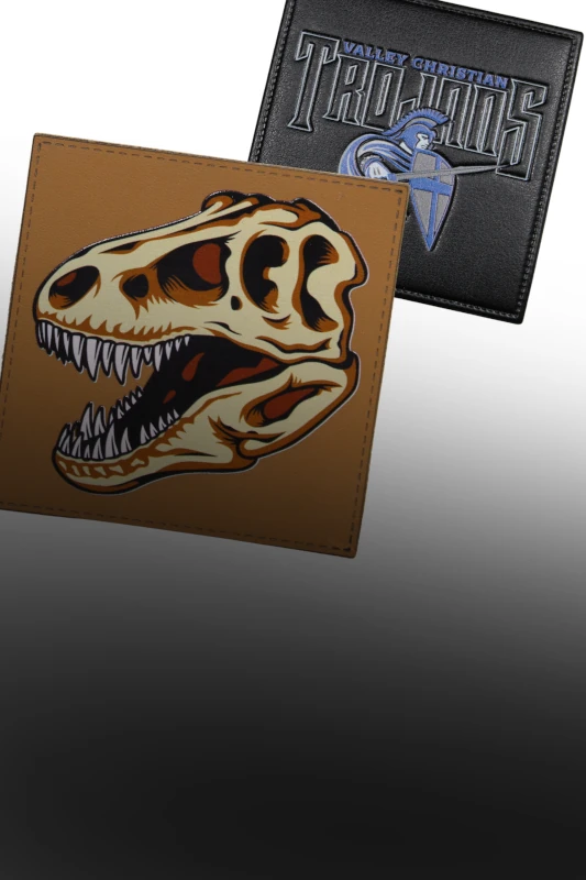 two leather patches with printed designs