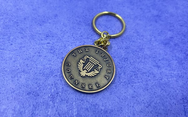 antique bronze 2D metal keychain for the injury council