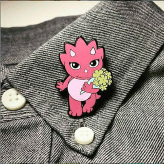 customized lapel pin of a pink cat