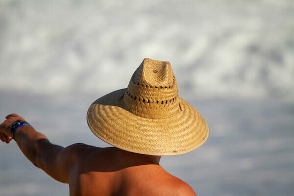 lifeguard wearng straw hat